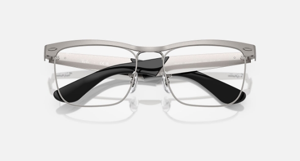 Modern metal and black frame eyeglasses on white background