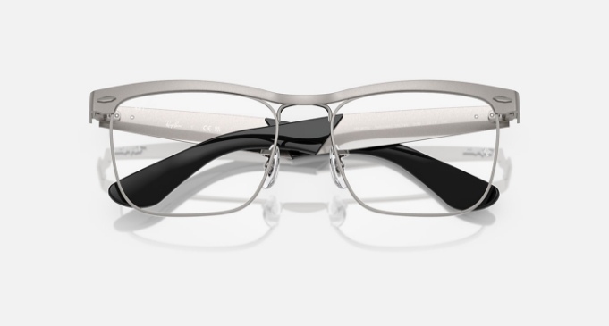 Modern metal and black rimmed eyeglasses on white background