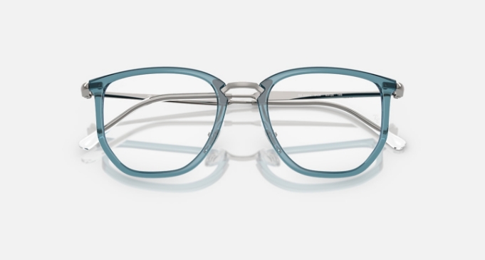 Blue transparent square eyeglasses with metal arms on white background