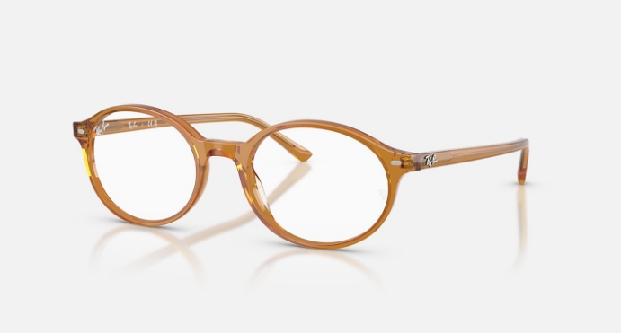 Transparent amber-colored round eyeglasses with thin frame on white background