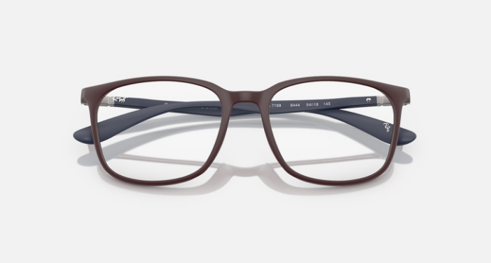 Brown and blue rectangular eyeglasses with modern design on white background