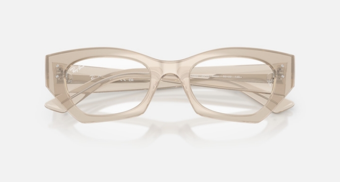 Transparent beige rectangular eyeglasses on a white background