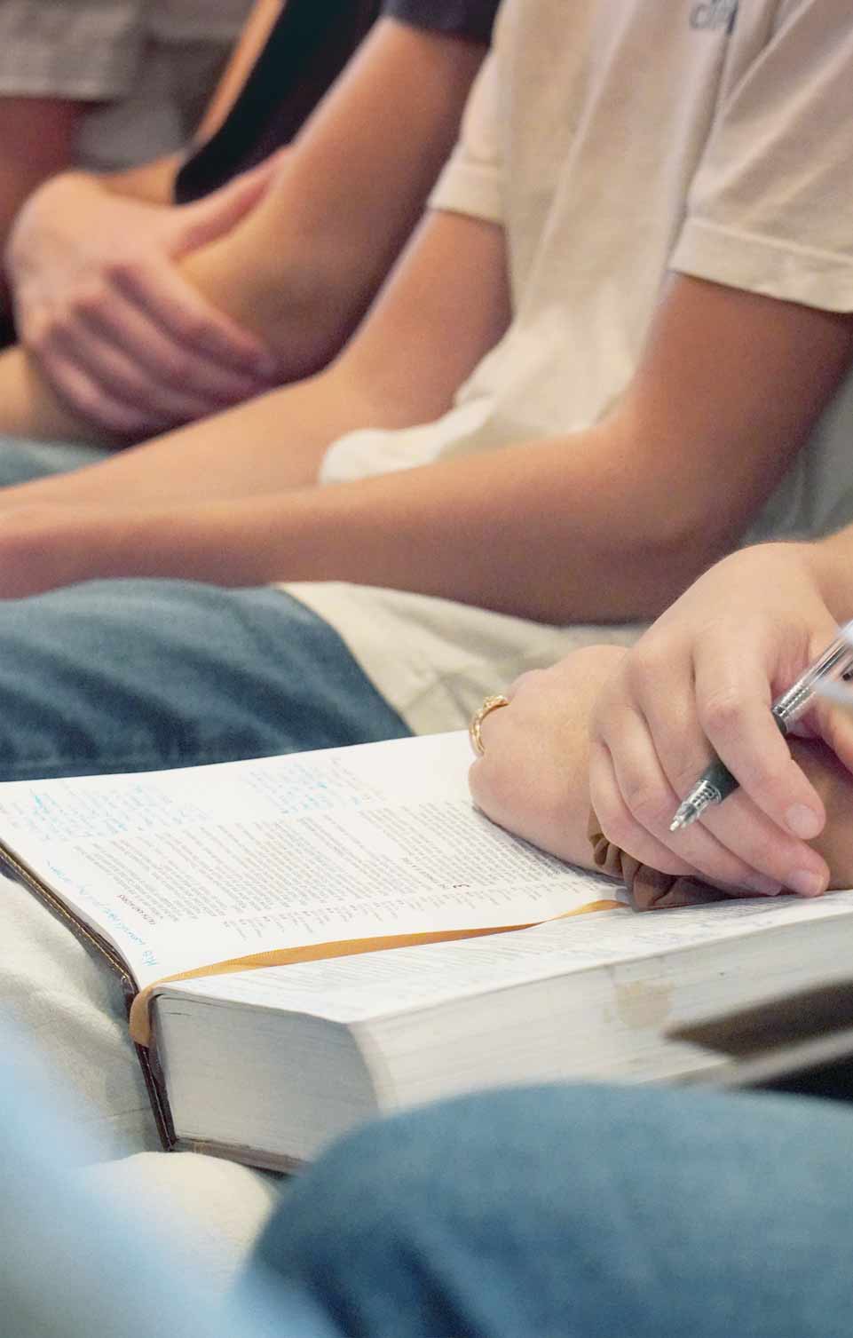 Harvest Church - Bible open and taking notes during a Sunday service