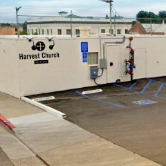 Thumbnail image of accessible parking behind the Harvest Church worship center