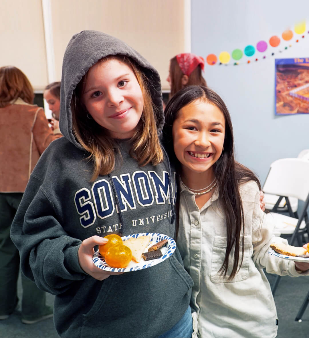 Two smiling 5th graders at a Club 56 Christian event at Harvest Church in Arroyo Grande