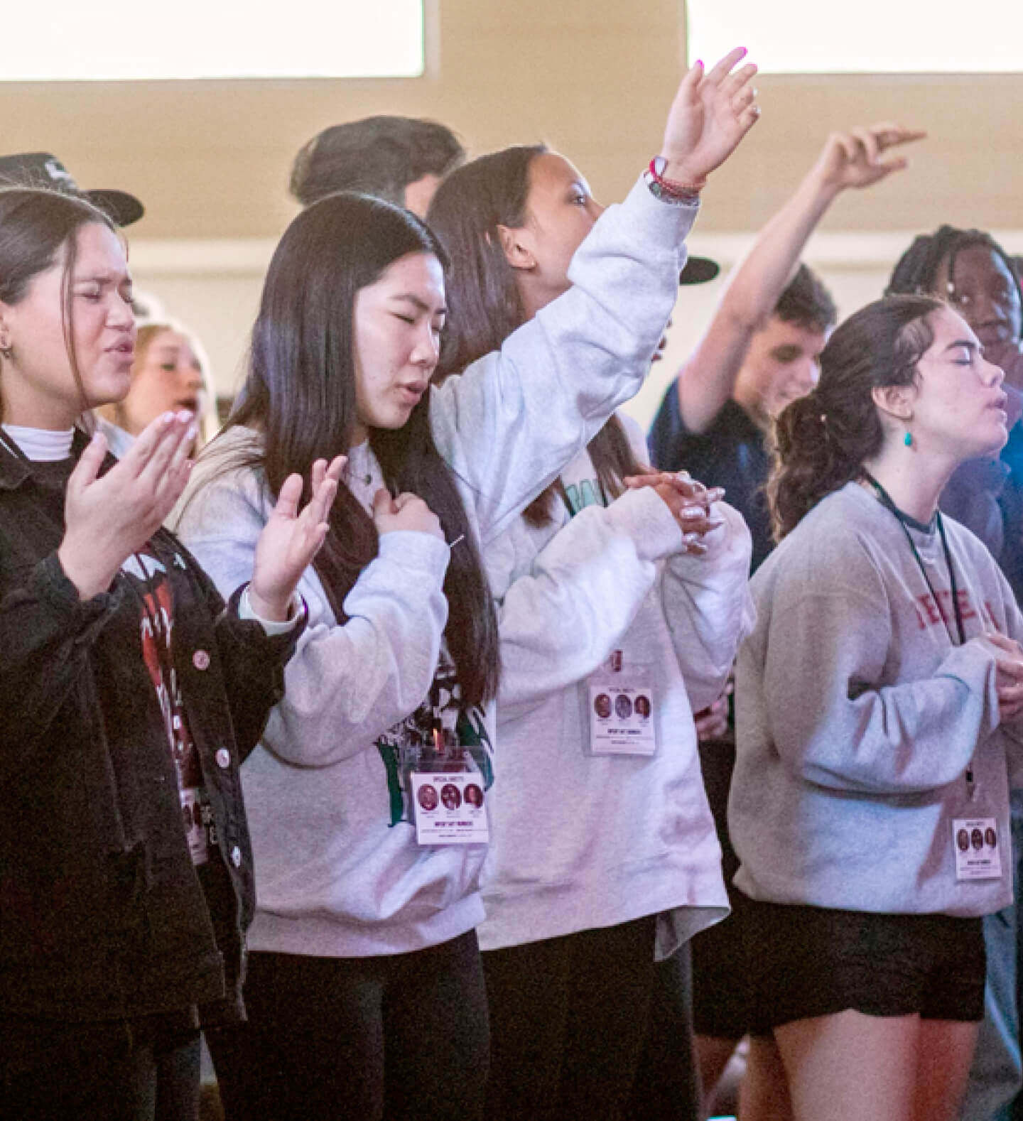 A photo of high schoolers worshipping God during a Harvest Church-supported missionary event led by Katie and Carlos Palma