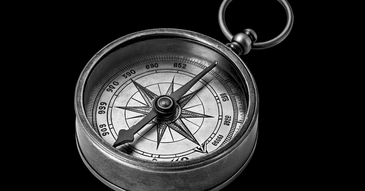 compass with arrow in middle