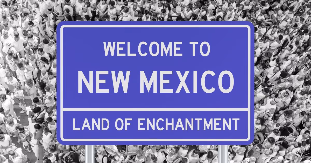 new mexico state sign with people in background