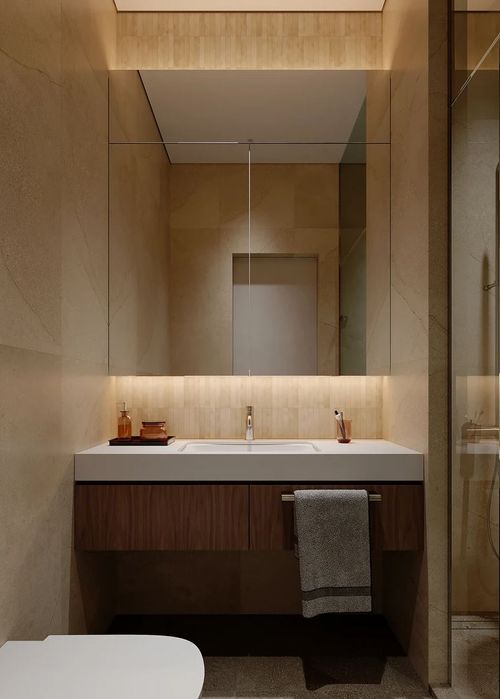 A contemporary building with a tree in the foreground.