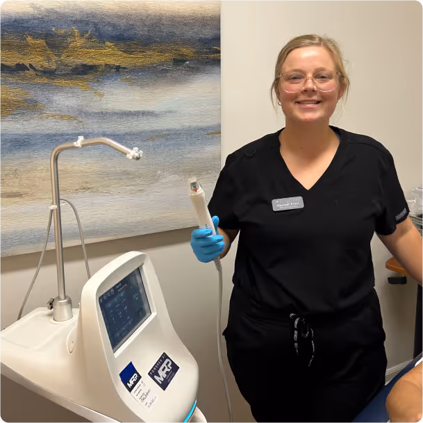 medical assistant holding a microneedling apparatus