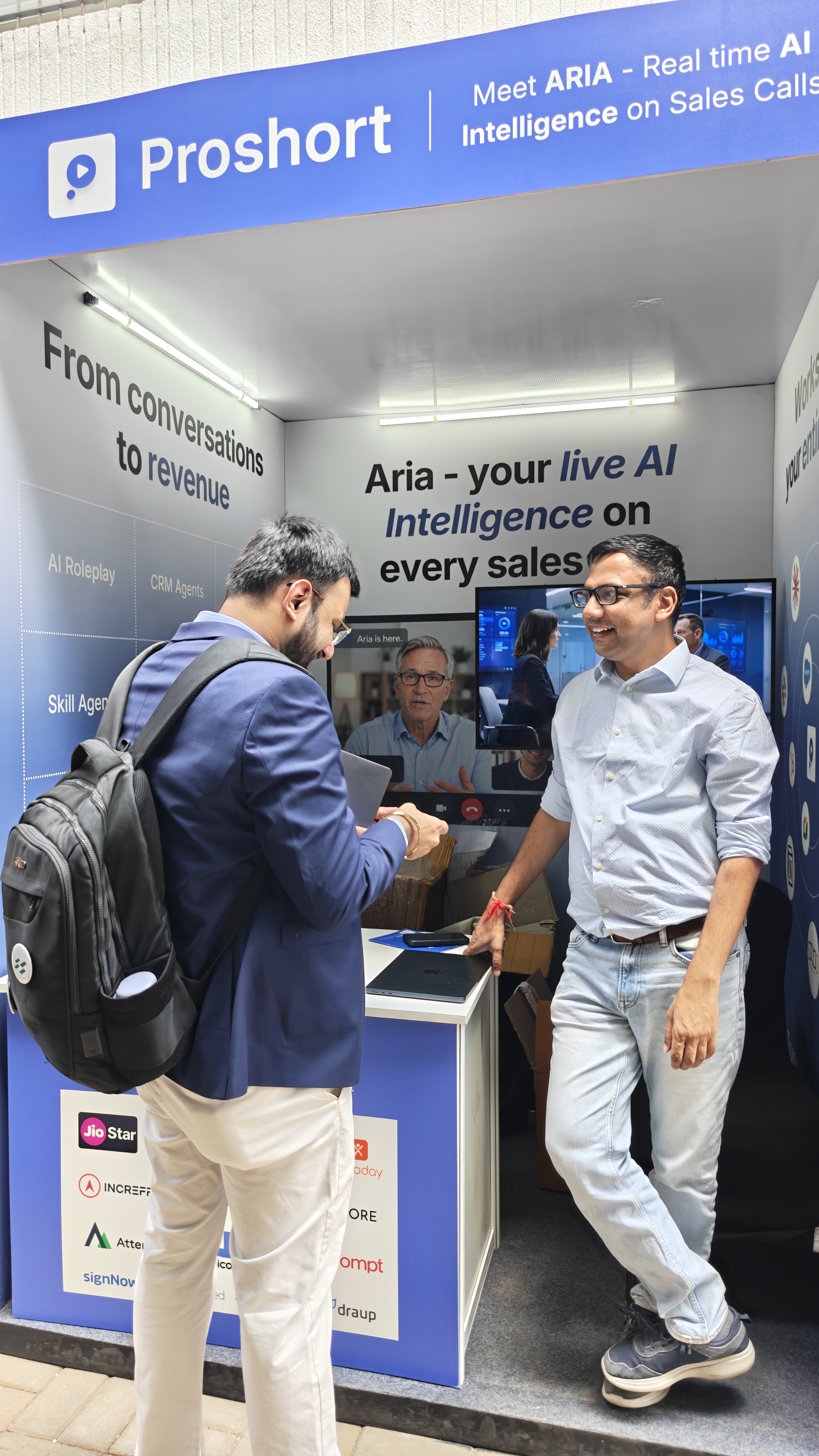 Nishant from Flowtrix talking with the Proshort team at TechSparks 2026