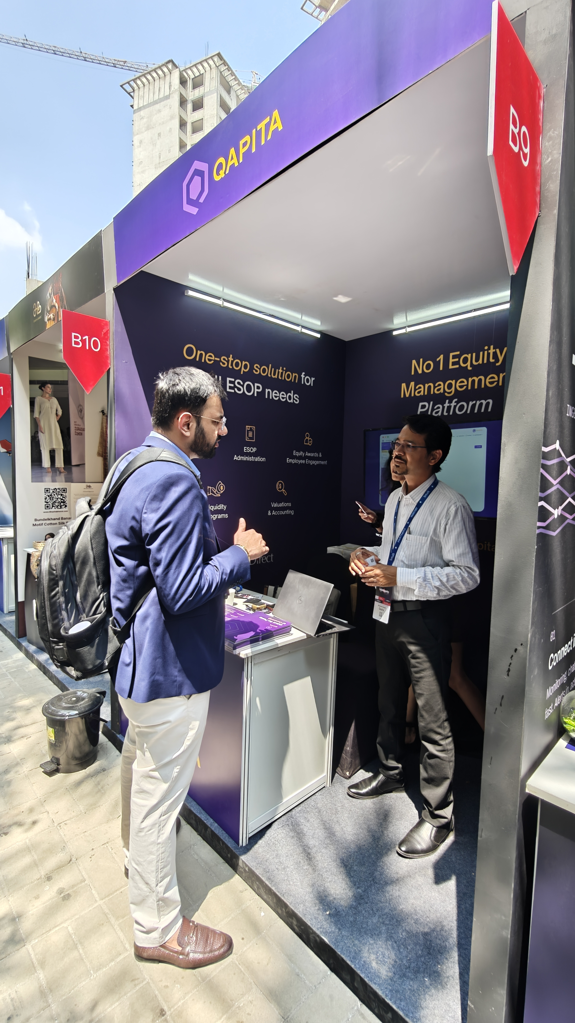 Nishant from Flowtrix talking with the Qapita team at TechSparks 2026