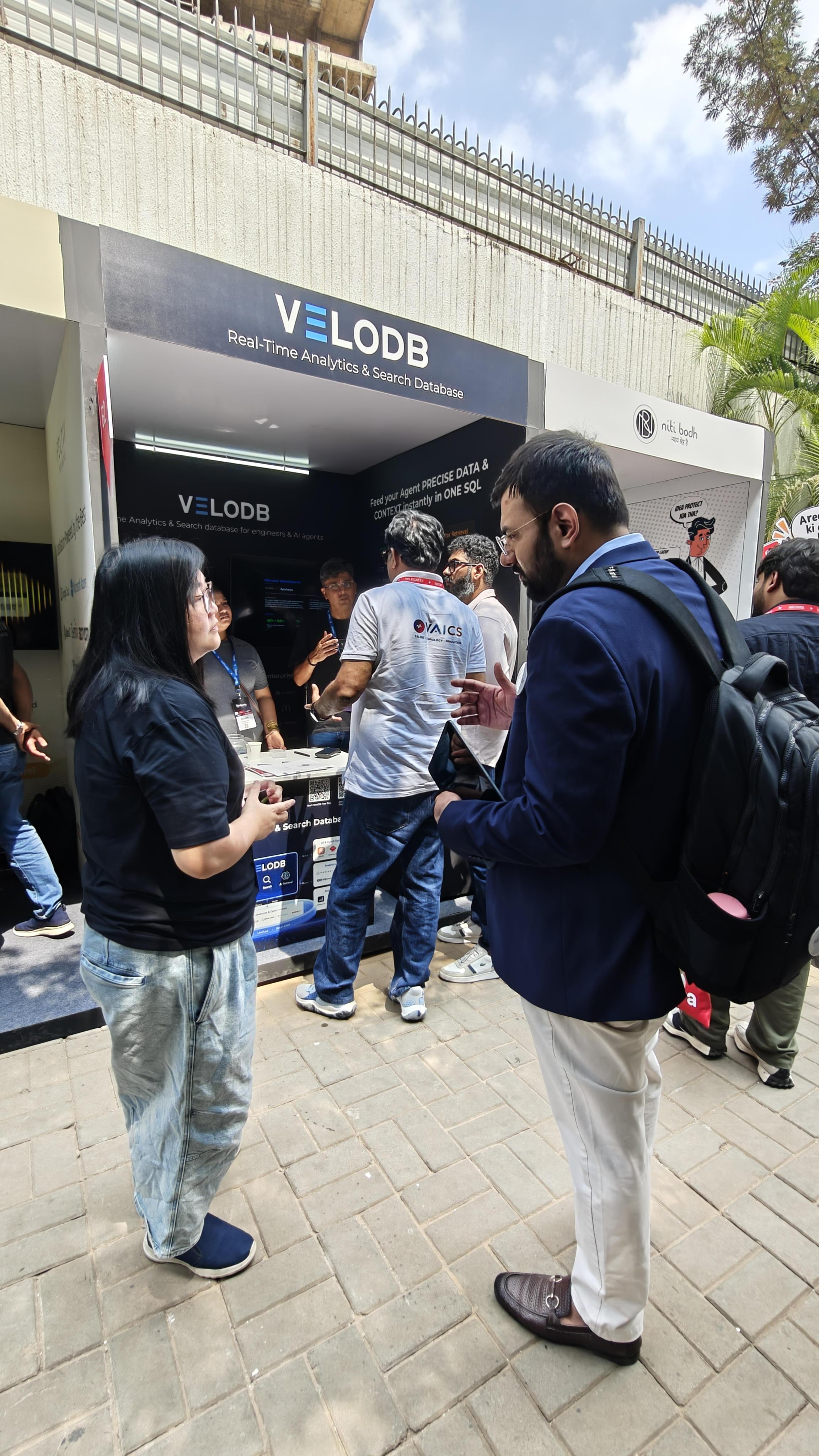 Nishant from Flowtrix talking with the VeloDB team at TechSparks 2026