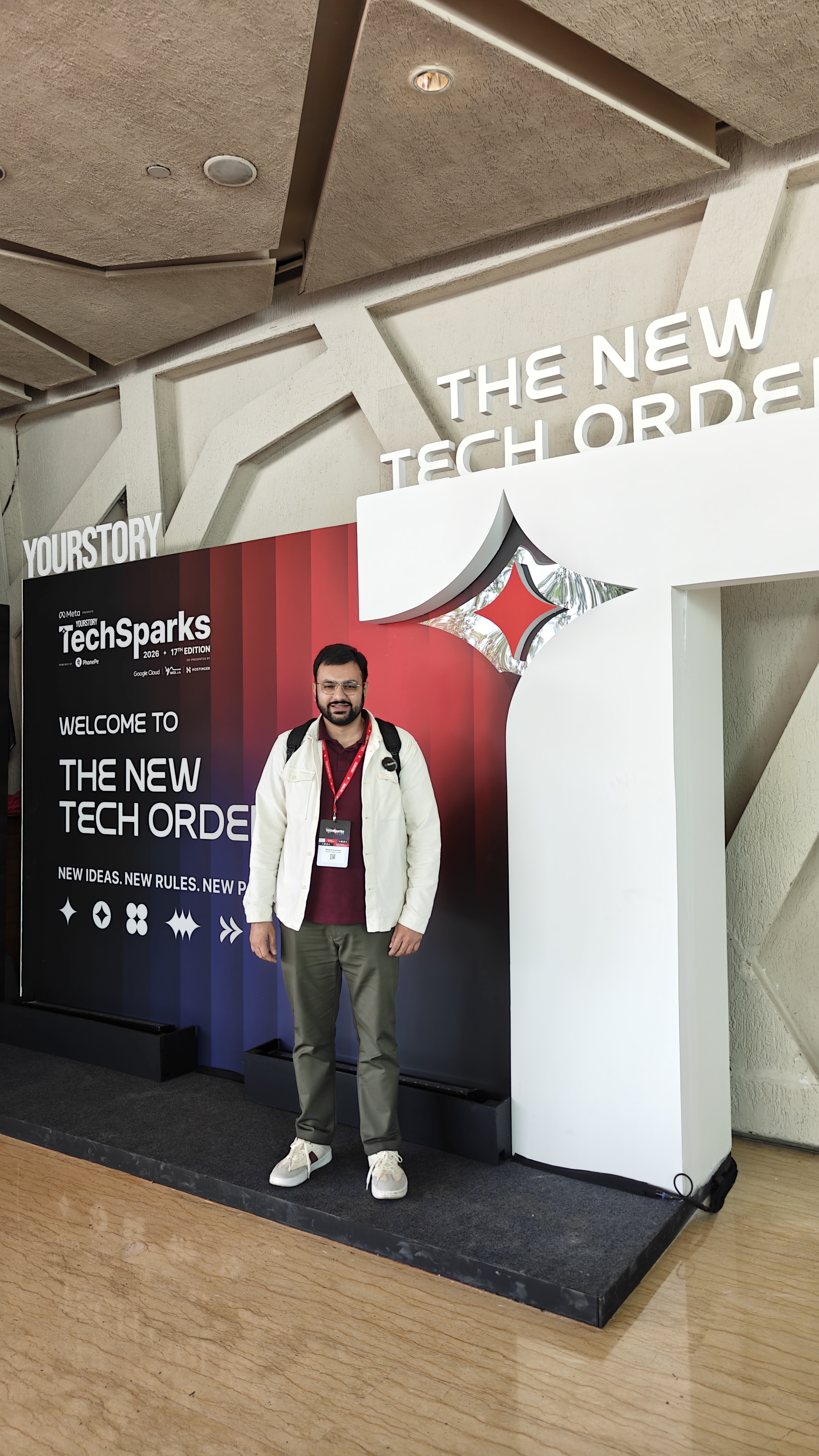 Nishant from Flowtrix at the TechSparks 2026 Welcome to The New Tech Order backdrop at Taj Yeshwantpur, Bengaluru