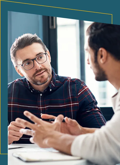 Two employees discussing work
