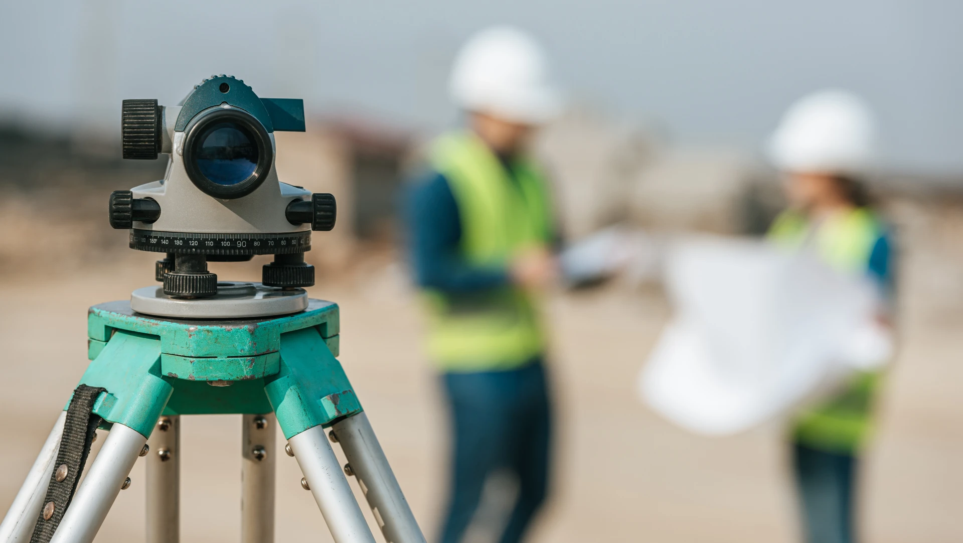 Surveying instrument on a construction site showing building surveyor inspection work that supports building reports and monitoring.