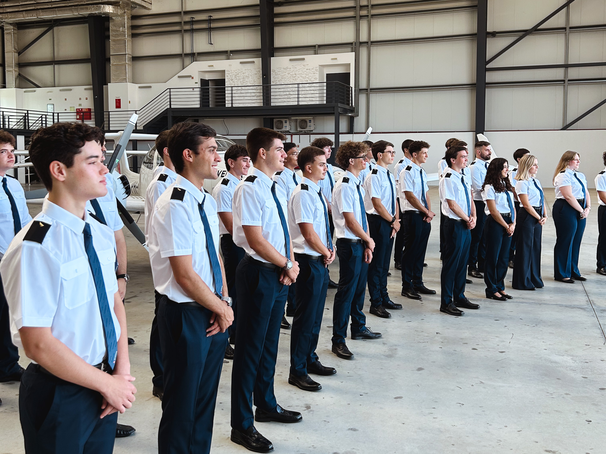 Sevenair Academy cadets class standing in formation inside hangar