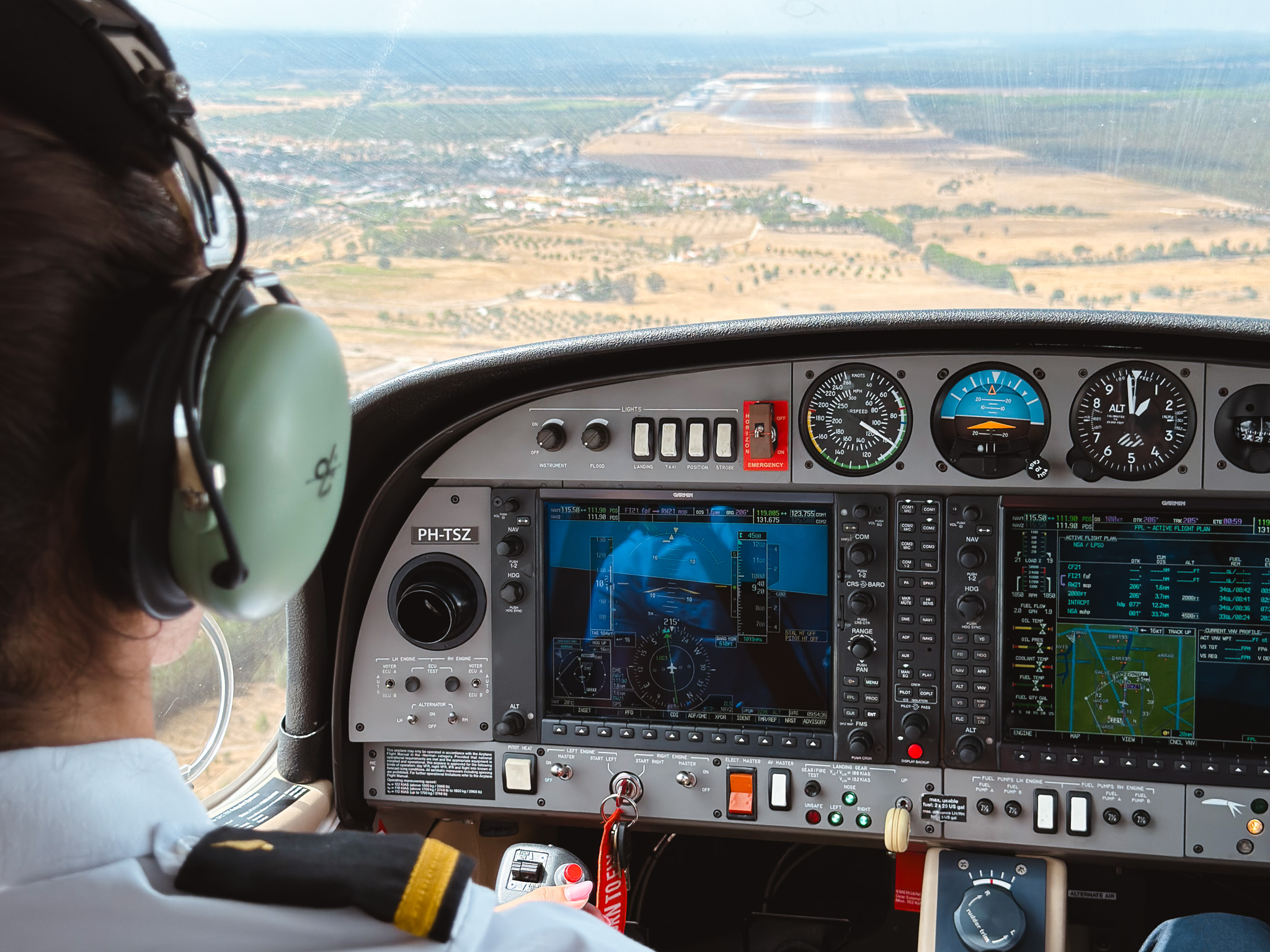 Student pilot flying a DA42 glass-cockpit training aircraft over the Alentejo countryside, Ponte de Sor