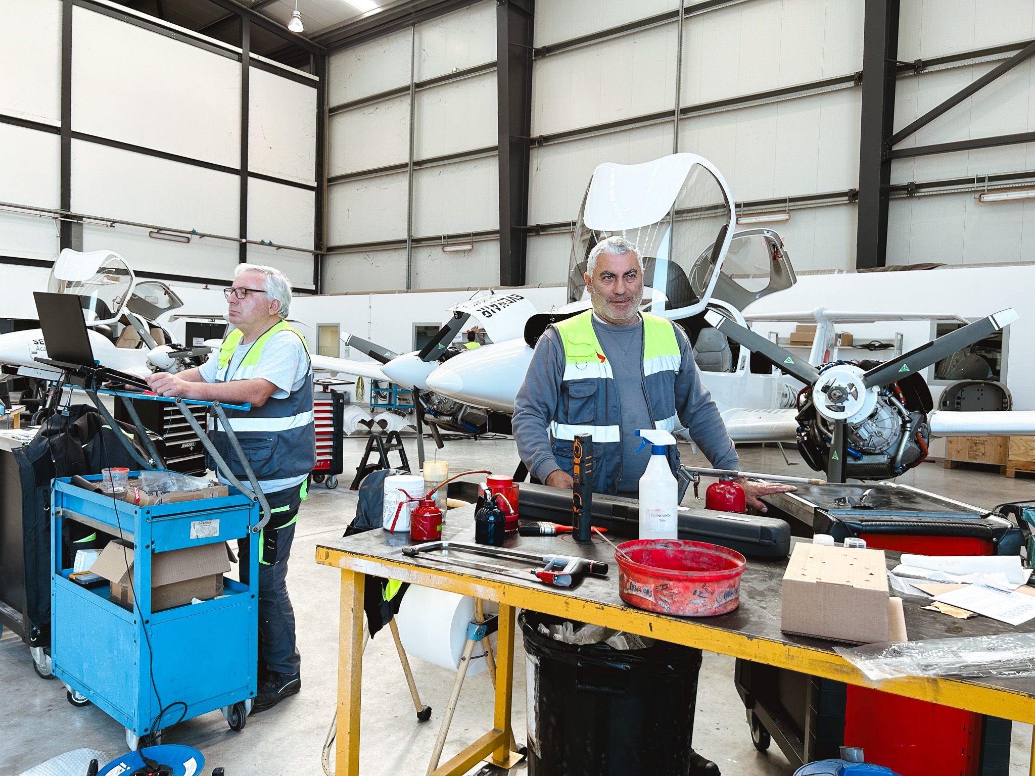 Sevenair Academy maintenance centre, workers stand in front of Diamond DA42 for scheduled maintenance
