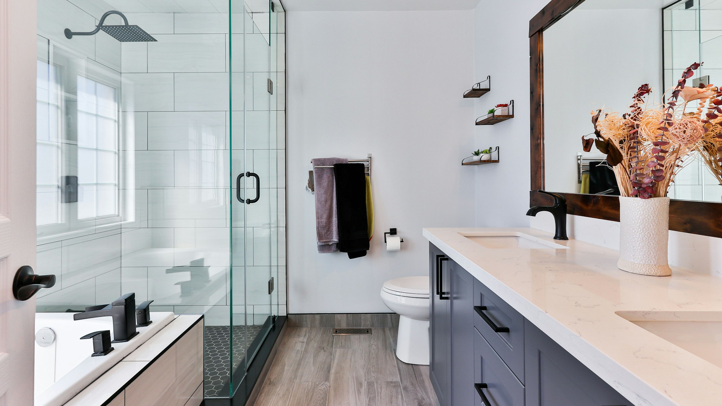Modern hotel bathroom with walk-in shower and vanity