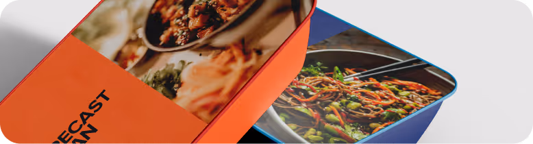 Two colorful food containers with cooked dishes, one with vegetables and noodles and the other with a stew served with rice.