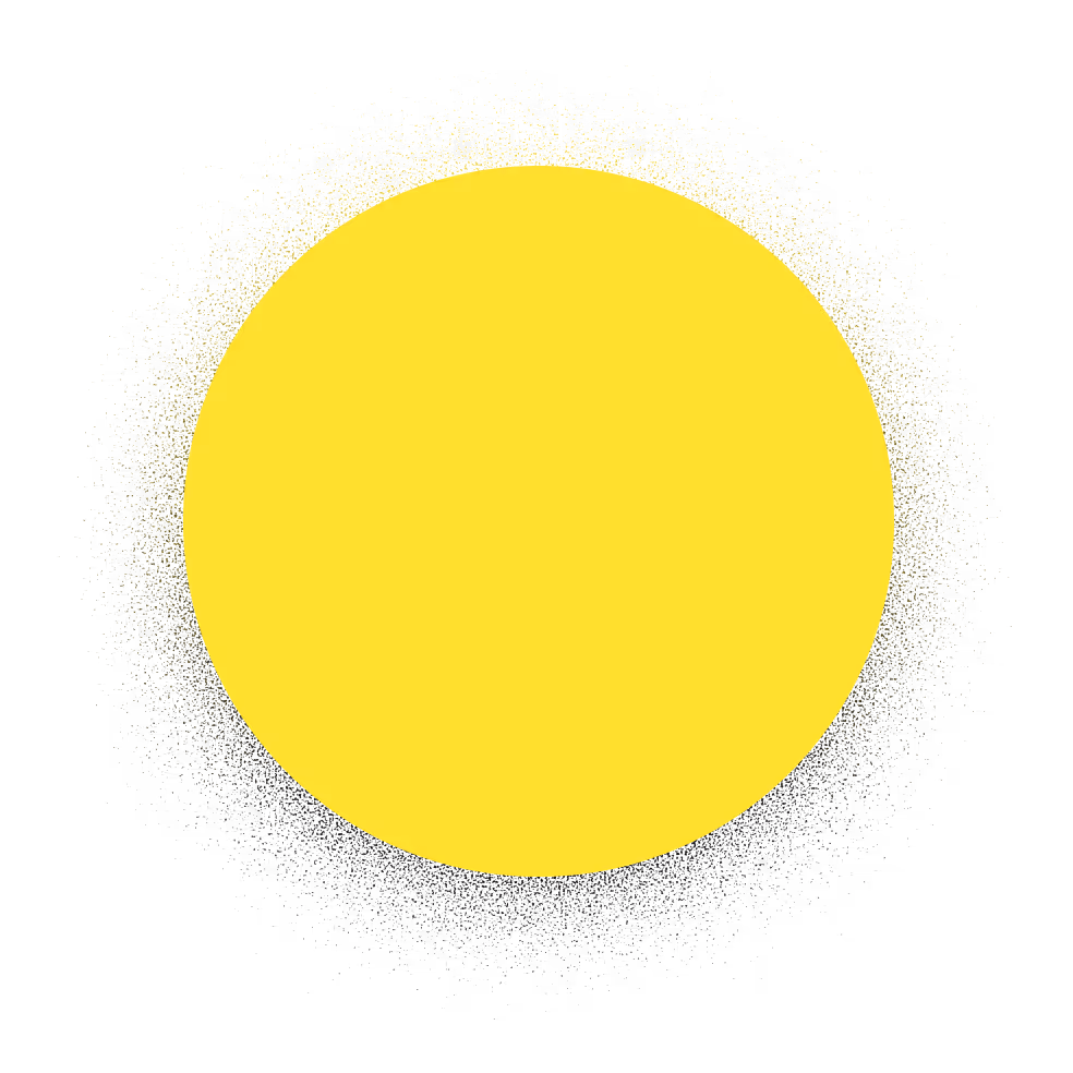 Bright yellow circle with a glowing, scattered halo effect on a black background.