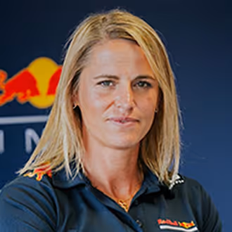Headshot of woman in Red Bull Racing polo shirt. 