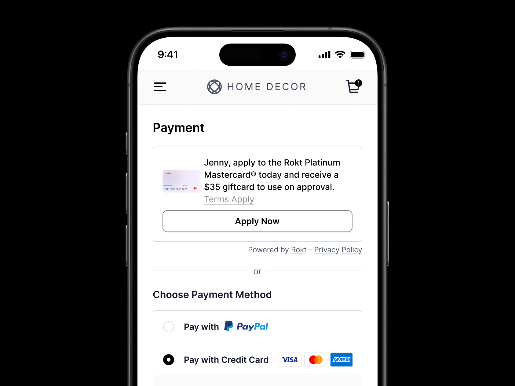 Mobile checkout screen for a website called "Home Decor" showing the payment section. At the top, there’s a promotional offer for the Rokt Platinum Mastercard, addressed to "Jenny," offering a $35 gift card upon approval, with a button labeled “Apply Now.” Below that, two payment method options are shown: “Pay with PayPal” (unchecked) and “Pay with Credit Card” (selected), with logos for Visa, Mastercard, and American Express displayed.