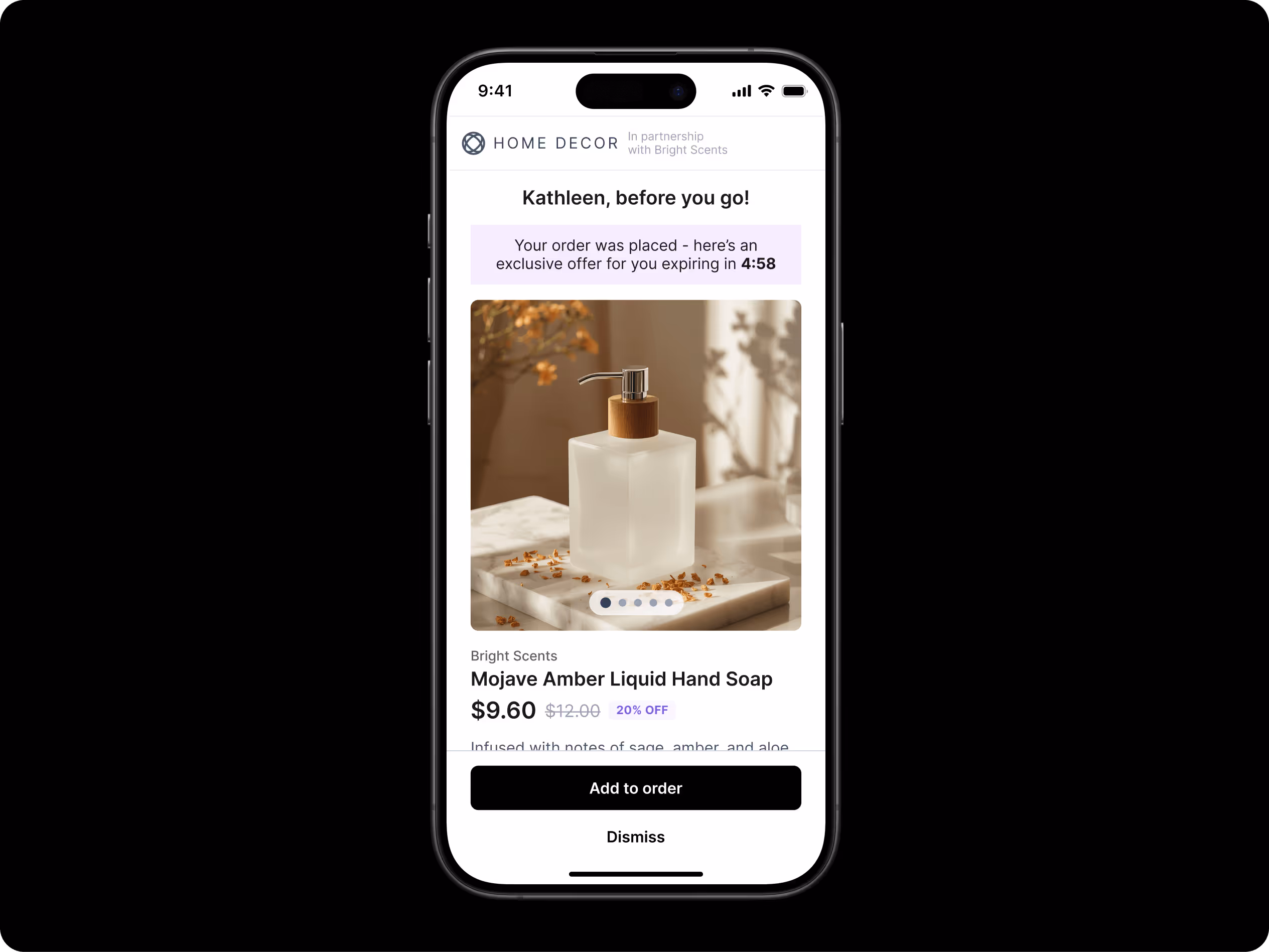 Smartphone screen showing a post-purchase offer from “Home Decor” in partnership with Bright Scents. The message at the top reads, “Kathleen, before you go!” followed by a purple banner noting an exclusive offer expiring in 4 minutes and 58 seconds. Below, a product image displays a frosted glass bottle of Mojave Amber Liquid Hand Soap with a metallic pump, placed on a marble surface scattered with dried botanicals. The price is discounted to $9.60 from $12.00 (20% off). Two buttons at the bottom read “Add to order” and “Dismiss.”