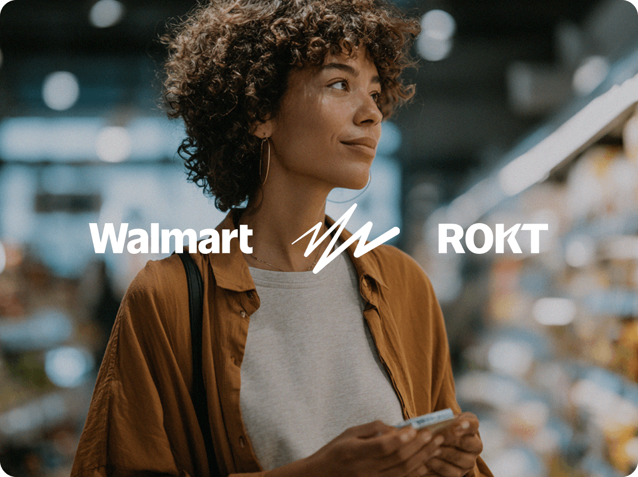 A young woman with curly hair stands thoughtfully in a brightly lit store aisle, holding a payment card in her hands. She wears a light gray shirt under an open rust-colored button-down and carries a black shoulder bag. The scene suggests she is mid-shopping, possibly considering a purchase. Overlaid on the image are the Walmart and Rokt logos, indicating a partnership or promotion related to retail or customer experience.