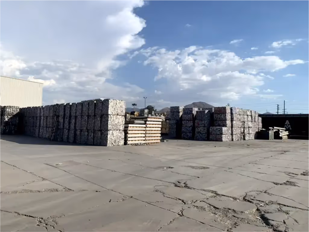 Stacks of compacted recycling cubes outside of the AIM recycling facility