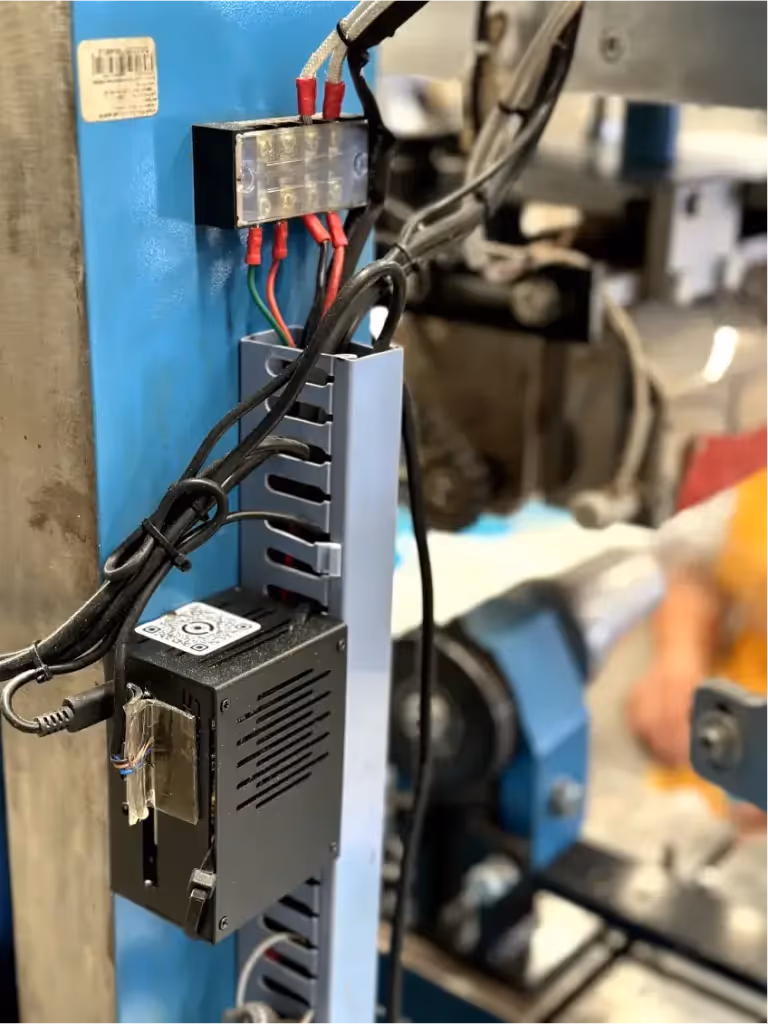 Zoomed in shot of a SensPro IOT™ box on a Sharp Plastics machine