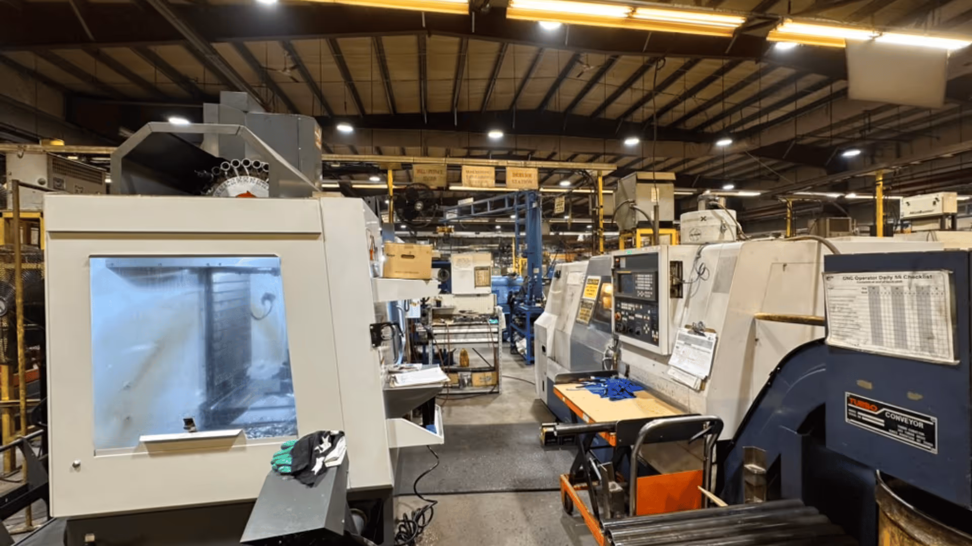 Picture of a shop floor with machines being monitored by SensFlo devices