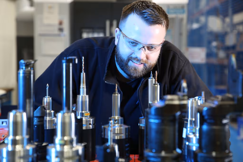 An AML employee looking at spindle heads