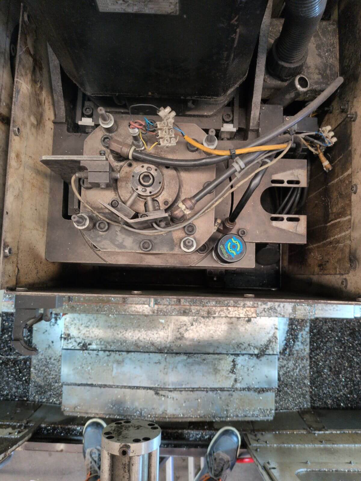 SensFlo sensor installed inside a vertical machining center to collect equipment condition and machine activity data.