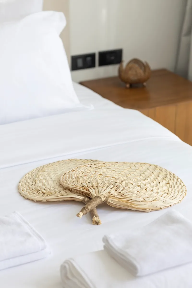 Bed with two hand fans