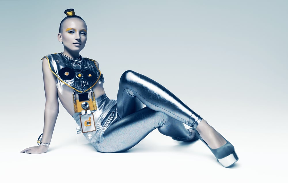 A futuristic model wearing an avant-garde metallic ensemble, embodying the fusion of technology and design that defines the next era of digital fashion communication.