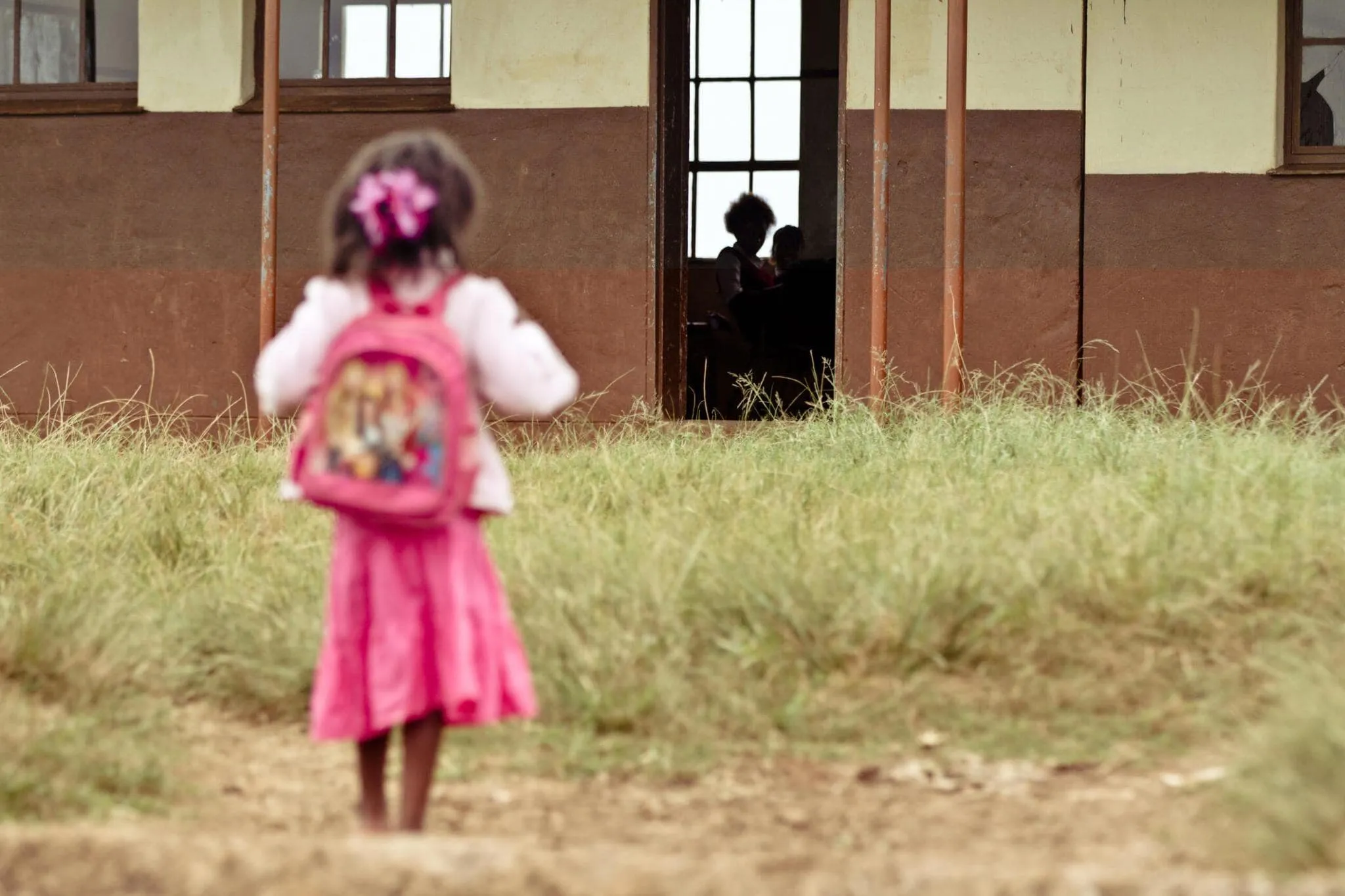 Student looking at her classroom