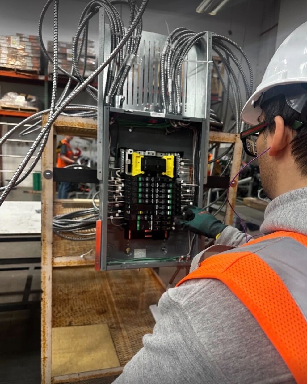 Smiling student wearing construction safety equipment