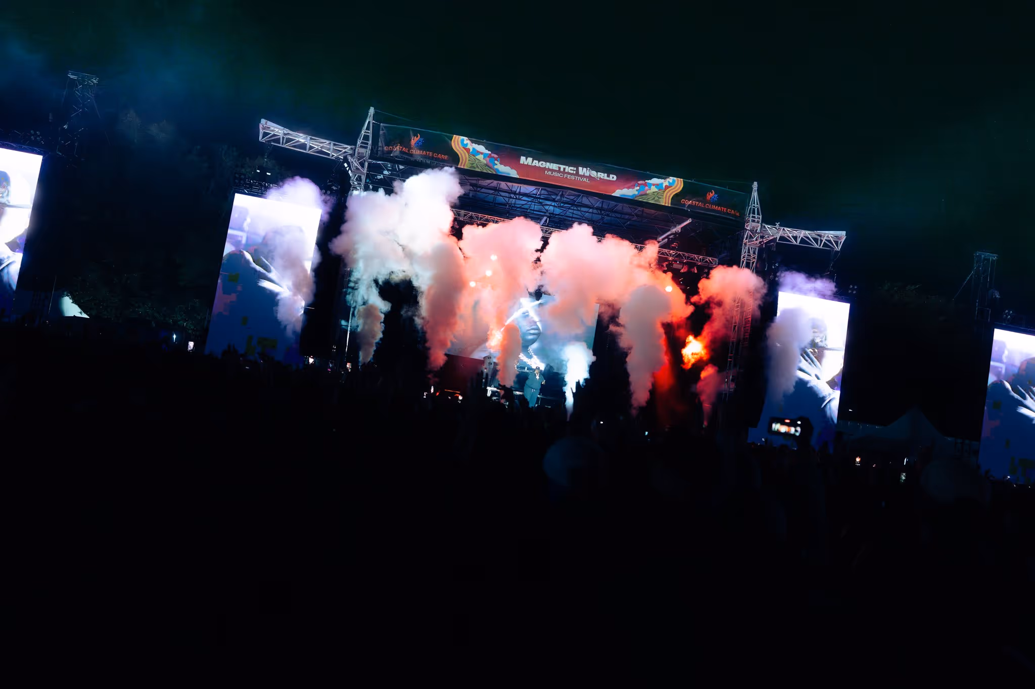 Magnetic World Music Festival mainstage firing CO2 jets over the crowd at night, Garrison Grounds, Halifax