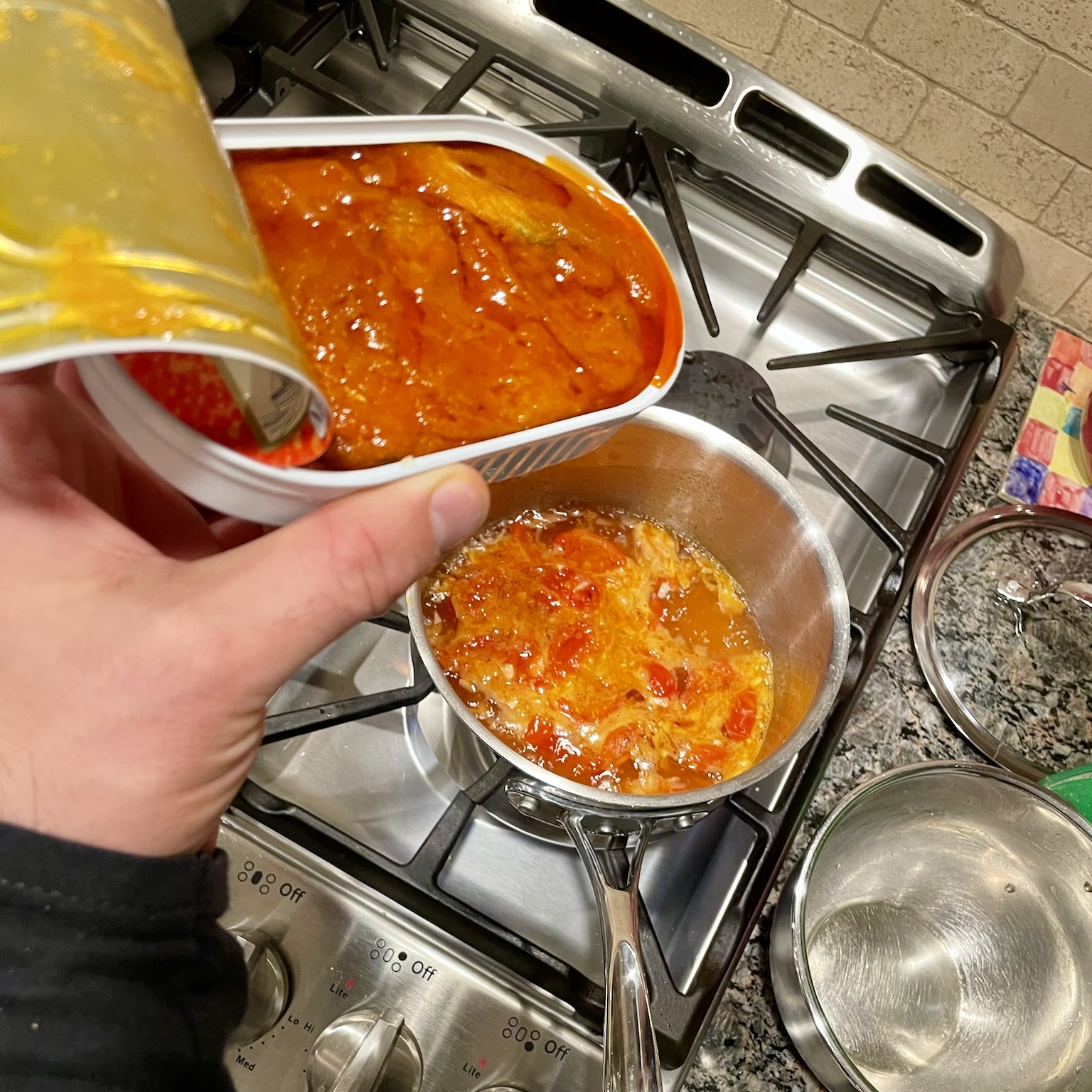 Herring tomato soup cooking
