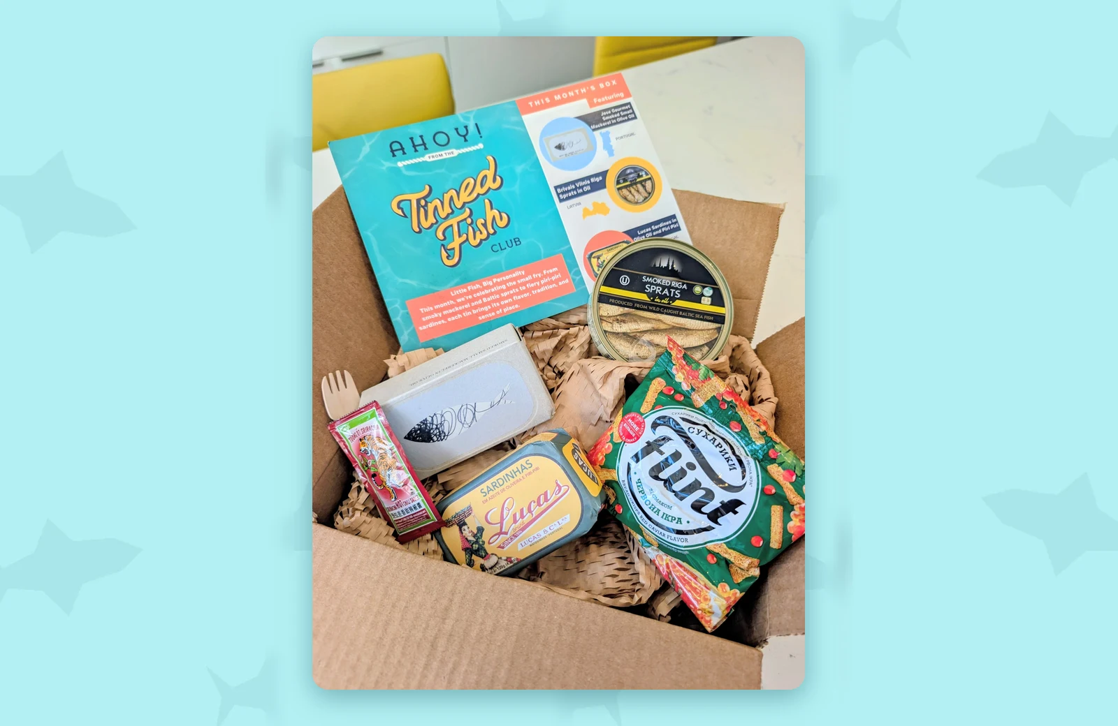 Tinned Fish Club September 2026 box with José Gourmet smoked mackerel, Brīvais Vilnis Riga sprats, Luças piri-piri sardines and Flint bread crisps