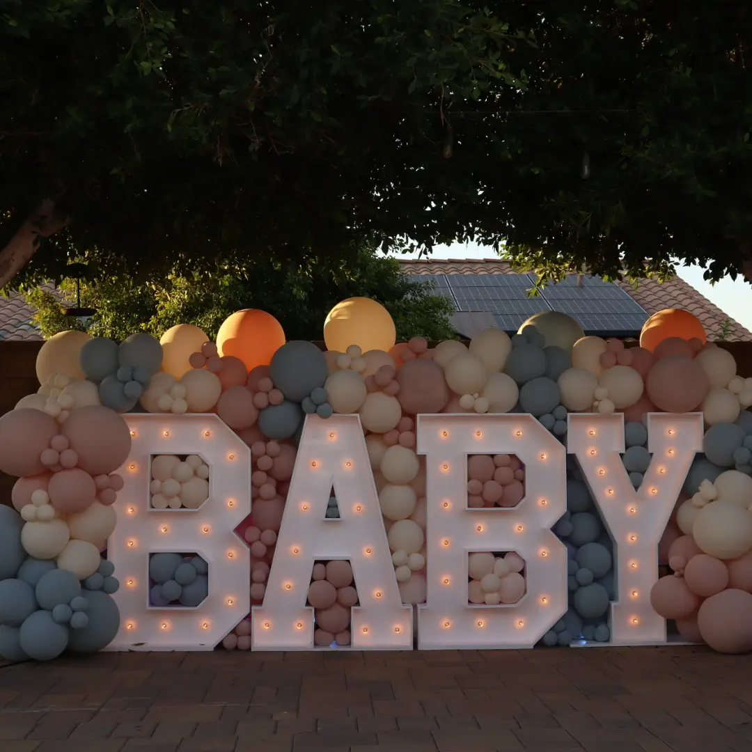 Gender Reveal “BABY” marquee letters and balloon installation