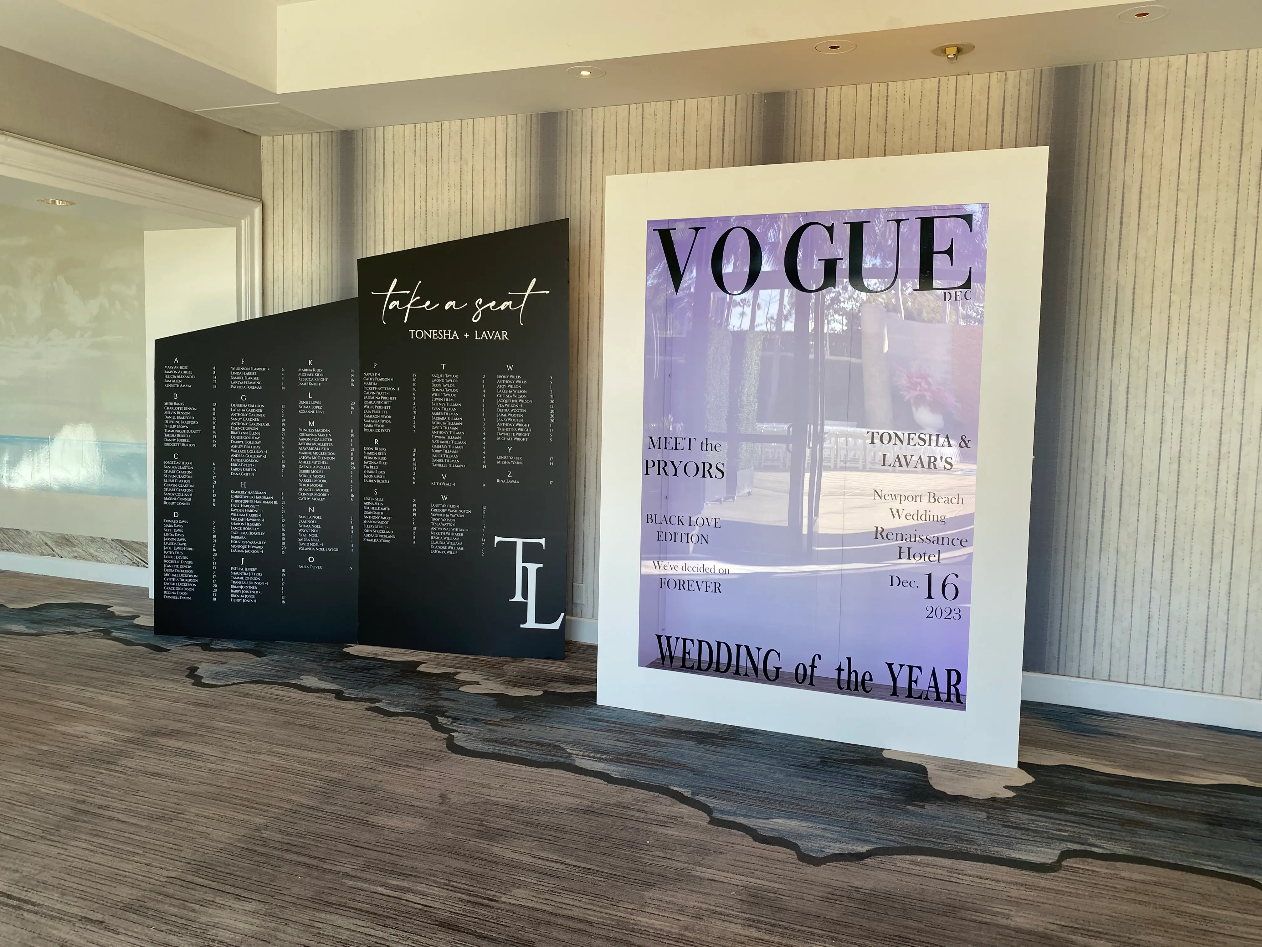 A large sign displaying the word "Vogue" at a photo booth for Vogue Magazine.