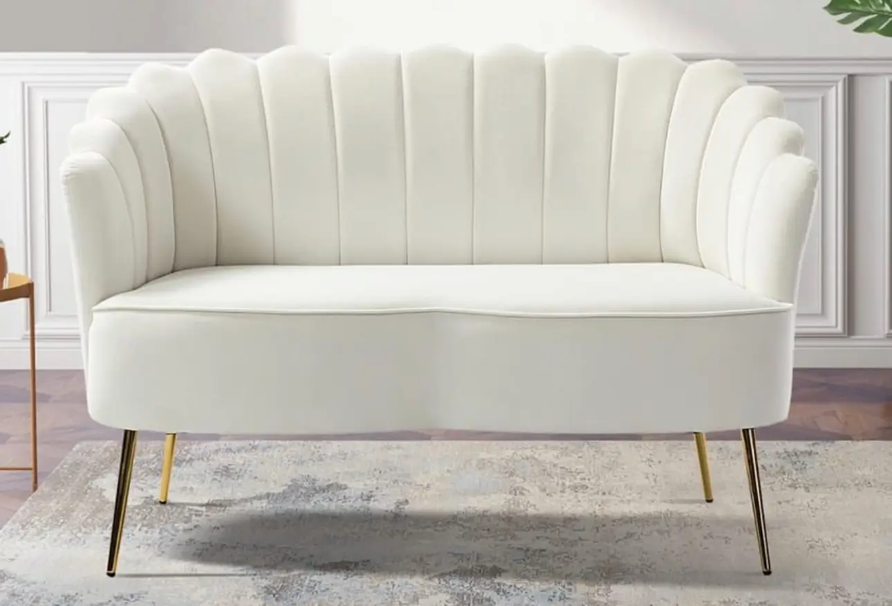 White sofa with gold legs and frame, designed for rental use, showcasing a modern and elegant aesthetic.