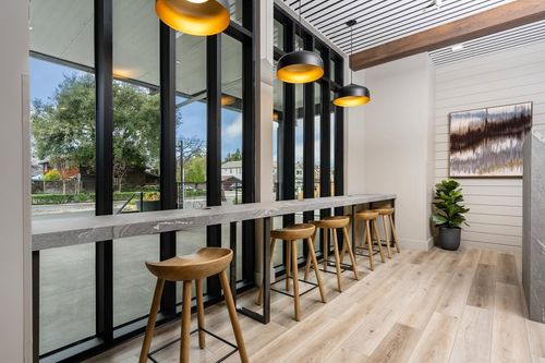 Bar stools at a counter looking out a window