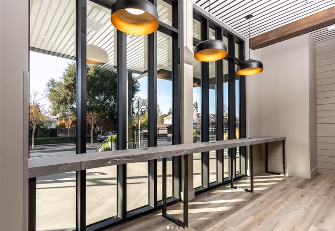 Large windows with a high top table looking out