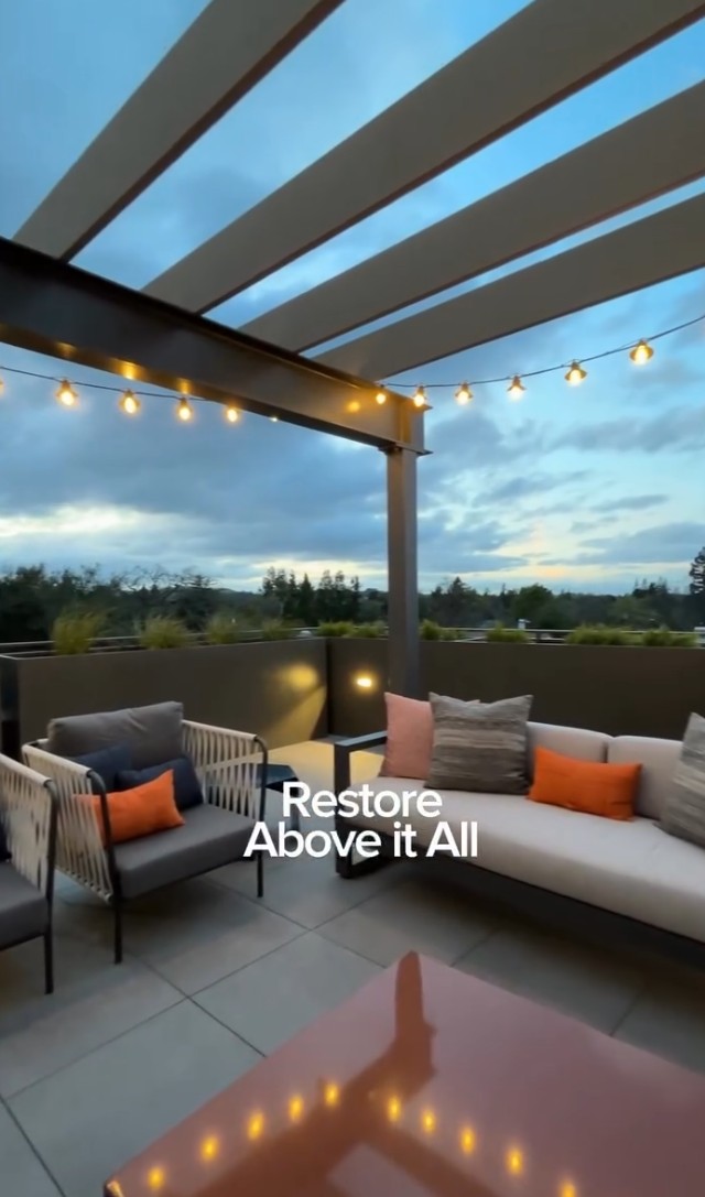 Covered outdoor lounge area with seating