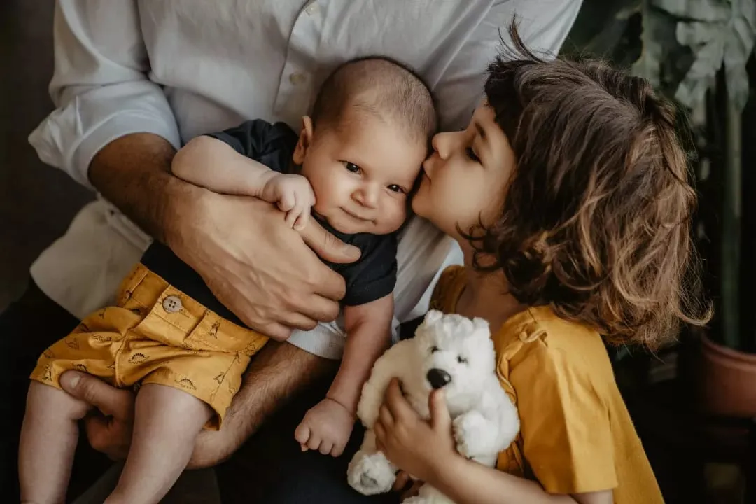 Mother with her baby and toddler