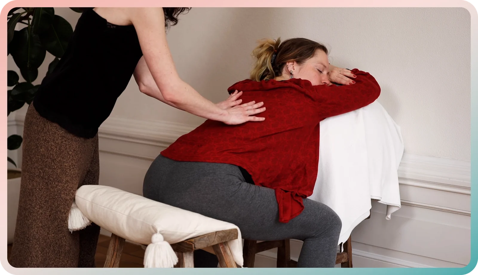Birth partner practicing a labor massage on a pregnant woman's lower back, from the hypnobirthing app